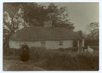 Old lady outside cottage near Andreas Rectory