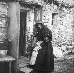 Woman entering Thatched Cottage, Sulby, Isle of Man