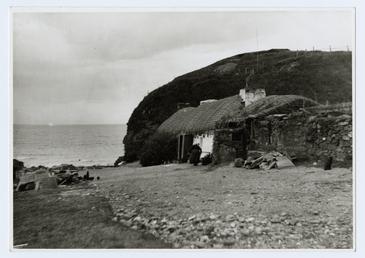 Old lady 'Nana Coof' outside cottage at Niarbyl