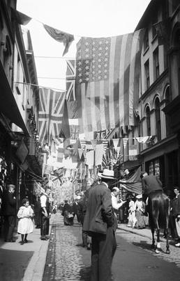 Crowded Strand Street, Douglas bedecked with bunting and…
