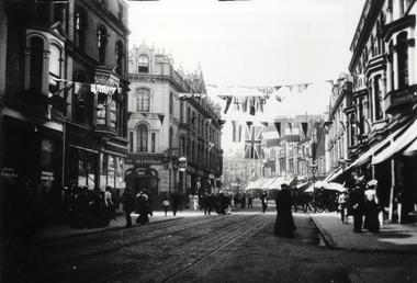 Victoria Street, Douglas bedecked with bunting and Union…
