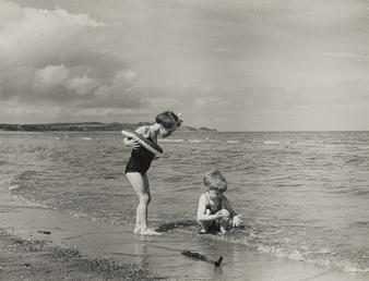 Two children on Ramsey shoreline, looking north towards…