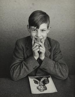Rodney Deakin, sitting with photograph in Ramsey Grammar…