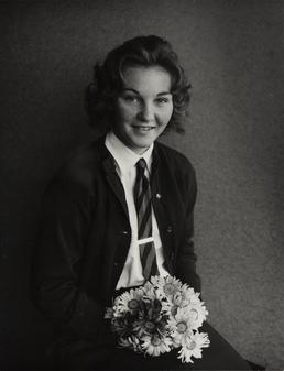 Valerie Duff, seated holding flowers in Ramsey Grammar…