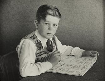 Dennis Gelling, seated with book in Ramsey Grammar…