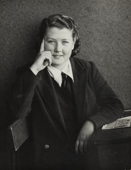Monica Smith, seated at desk in Ramsey Grammar…