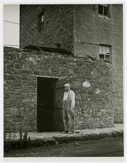 Mr Faragher, standing outside the mill