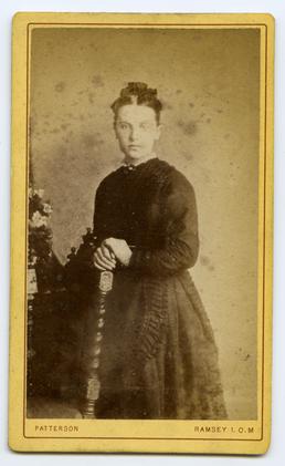 Studio portrait of young lady in Victorian dress