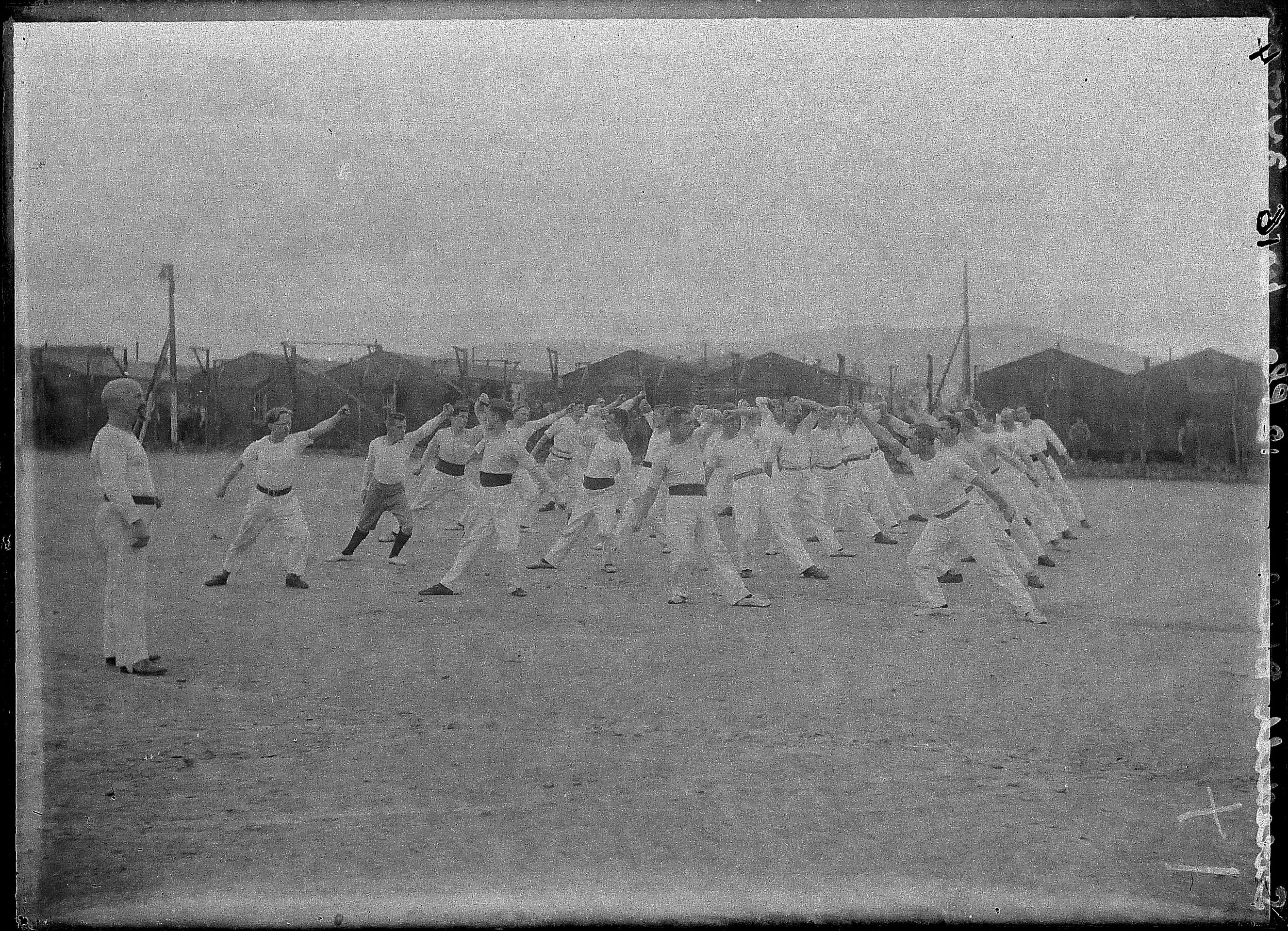 First World War Internee Physical Exercise Group (Huts and Wire in  background), Knockaloe Camp, Isle of Man - Photographic Archive - iMuseum
